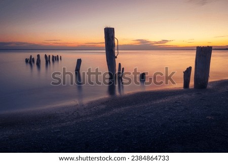 Early morning image of abandoned pier at lake.
