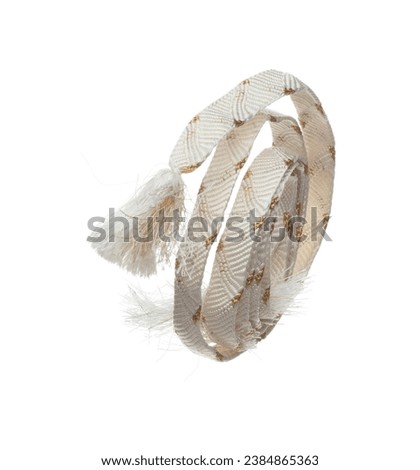String rope obi Japanese Traditional Komono equipment fly in air with curve. String rope obi Japanese Traditional Komono fabric is beautiful clothes for ceremony event. White background isolated Royalty-Free Stock Photo #2384865363