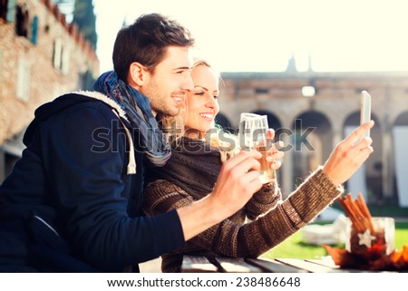 couple gets a Selfie while drinking aperitif