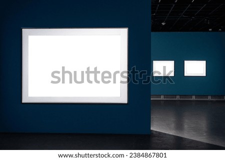 white wall with blank frame in gallery