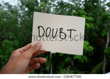 Handwritten message paper STOP SELF DOUBT, concept of self worth , stop striving for approval, more valid , more loved or validation , you are good enough Royalty-Free Stock Photo #2384877581