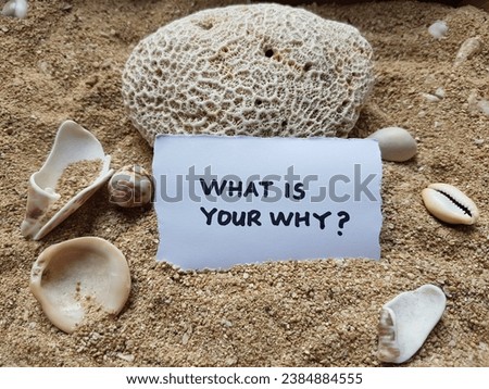 What is your why writing on beach sand background.