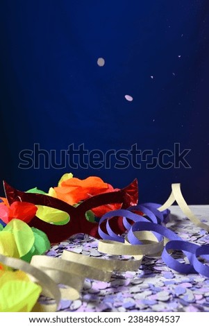 red carnival costume mask with colorful confetti and streamers joyful brazilian party celebration on white background with space for text carnaval