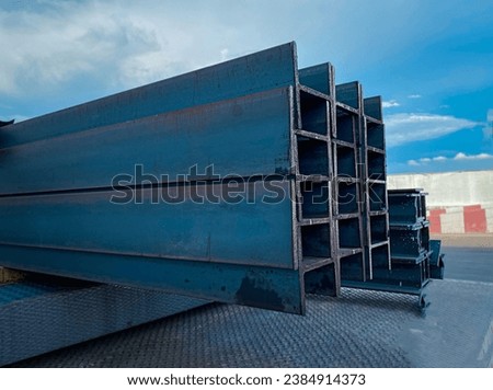 Steel beams production. Metal girders stack on project construction , steel h-beam, selective focus, Raw materials used in building construction. Royalty-Free Stock Photo #2384914373