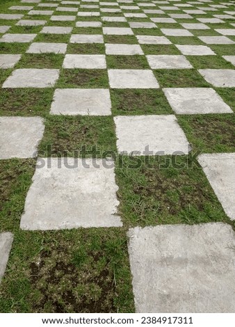 a chessboard-patterned garden like in Alice in Wonderland