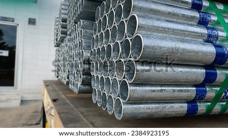 plumbing steel,high quality Galvanized steel pipe or Aluminum and chrome stainless pipes in stack waiting for shipment in warehouse Royalty-Free Stock Photo #2384923195