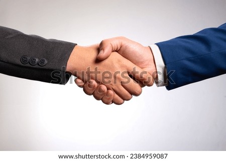 Holding hands with business partners to trust business partners, relationships to achieve future commercial and investment goals. Royalty-Free Stock Photo #2384959087