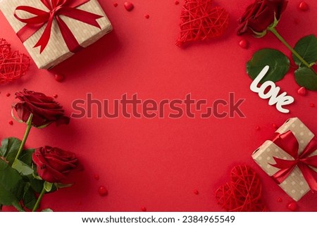 Valentine's Day love theme. Overhead shot of kraft gift boxes, heart-shaped rattan decorations, bunch of crimson roses, "love" for sweet confessions, sprinkles on red backdrop, frame for your message Royalty-Free Stock Photo #2384965549