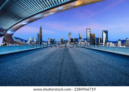 Asphalt road and urban skyline with modern buildings in Shenzhen, Guangdong Province, China.