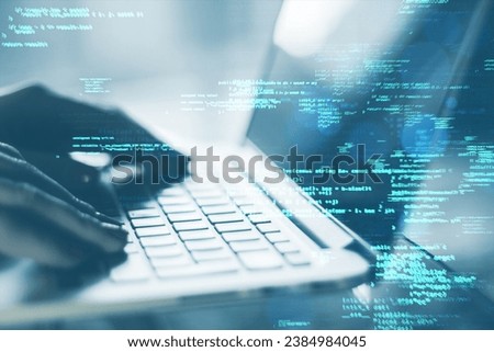 Close up of male hands using laptop keyboard on desk with creative coding html language on blurry background. Web developer and programming concept. Double exposure