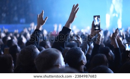 Lot fun people record music video use mobile phone. Fan crowd shoot k pop live concert. Many men hang out cool rave fest. Joy group chill night club hall. Dj star raise hand up. Make neon light photo. Royalty-Free Stock Photo #2384987683