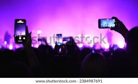 Lot fun people record music video use mobile phone. Fan crowd shoot k pop live concert. Many men hang out cool rave fest. Joy group chill night club hall. Dj star raise hand up. Make neon light photo. Royalty-Free Stock Photo #2384987691