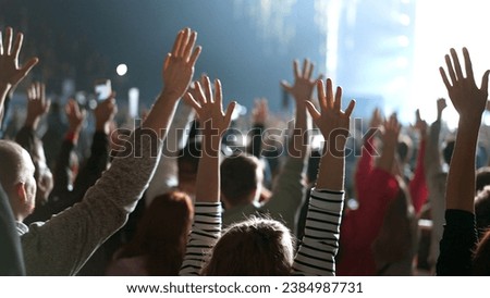 Many joy people raise hands up into sky. Fun live music concert. Sectarians crowd pray god. Lot sect fans follow faith. Holy worship concept. Epic rite open air. Big group lift arms. Huge ritual cults Royalty-Free Stock Photo #2384987731