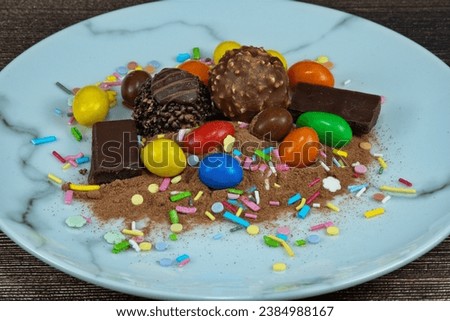 Mixed of sweets, candy on a plate. Don't eat too much!