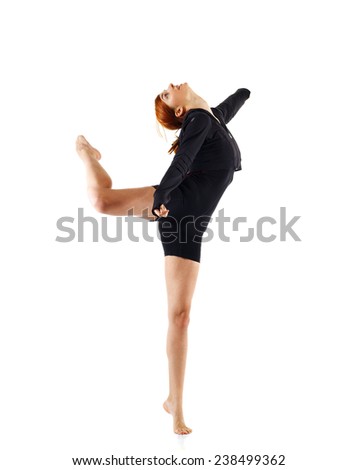 Young girl doing gymnastics exercise isolated over white