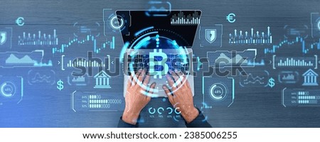 Top view of man hands typing on laptop, bitcoin icon with graph chart and digital indicators dashboard. Concept of cryptocurrency, money investment and statistics