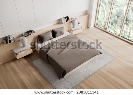 Top view of white bedroom interior with bed and nightstand with decoration, carpet on hardwood floor. Sleep corner with panoramic window on tropics. 3D rendering