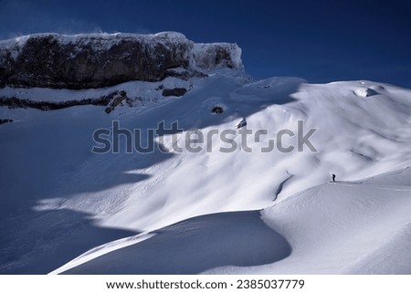 A Ski Driver in a Winter Mountain Landscape, An Alpine Scenery in Winter and a Ski Driver, Snow Capped Mountains and A Winter Sportler, Winter Wonderland in The Mountains, Snow Sports in The Alps, 