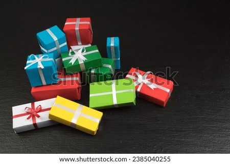 Gift boxes and colorful present for christmas on blackboard. Top view with copy space