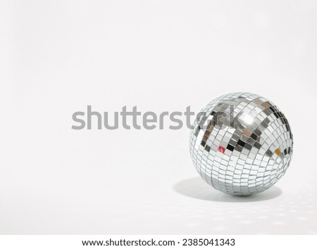 Mirror shining disco ball isolated. Copy space for text. Concept of party and celebration. Royalty-Free Stock Photo #2385041343