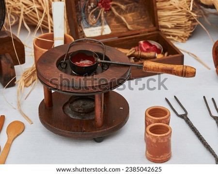 A picture of a beautiful medieval hot wax stove