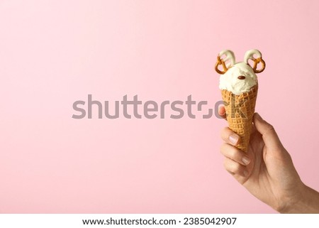 Ice cream cone with pretzels on a light background