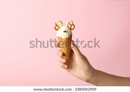 Ice cream cone with pretzels on a light background