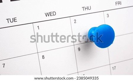 Blue color pin thumbtack a date 2nd calendar or planner. 
Final Day takes place deadline Thursday 2 day.   (selective focus) Royalty-Free Stock Photo #2385049335