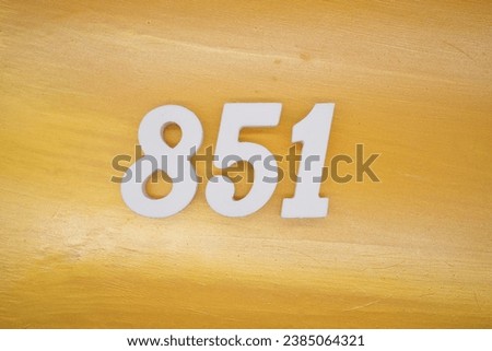 The golden yellow painted wood panel for the background, number 851, is made from white painted wood.