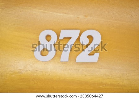 The golden yellow painted wood panel for the background, number 872, is made from white painted wood.