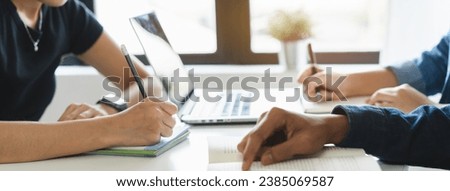 Close up hands of university student studying in class and taking note in notebook. Royalty-Free Stock Photo #2385069587
