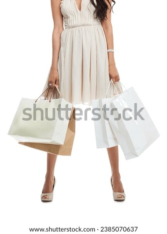 Hands, legs and woman with shopping bags for fashion in dress isolated on a white background. Body of customer with gift in boutique, sales discount and retail market clothes or deal in luxury mall