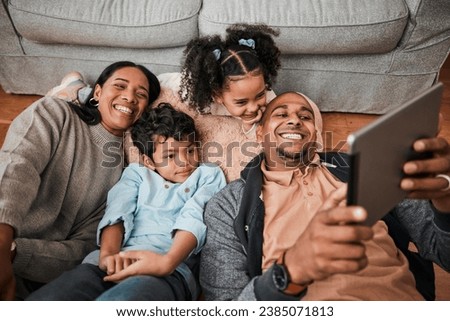 Family, children and parents on tablet for video, movie or cartoon streaming on internet subscription and living room floor. Home, selfie and happy mom, dad and interracial kids on digital technology