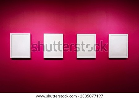 Collection of Blank white color picture frame templates for place image or text inside on the colorful pink wall. Exhibition gallery.