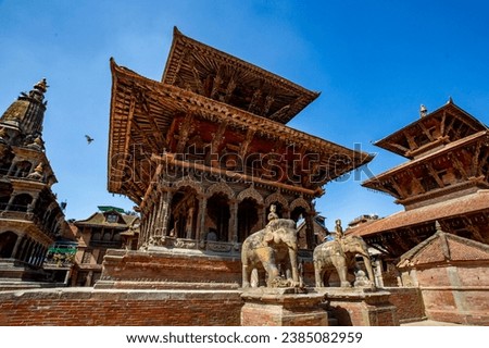Patan Durbar Square is situated at the center of Lalitpur, Nepal. It is one of the three Durbar Squares in the Kathmandu Valley, all of which are UNESCO World Heritage Sites.  Royalty-Free Stock Photo #2385082959