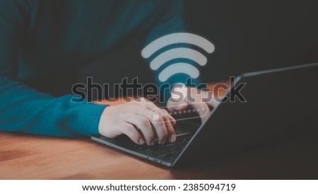 User use a computer laptop to connect to wifi in hotel, but wifi password is incorrect. Working and waiting to loading digital data form website, concept technology of waiting for connect to Wi-Fi. Royalty-Free Stock Photo #2385094719