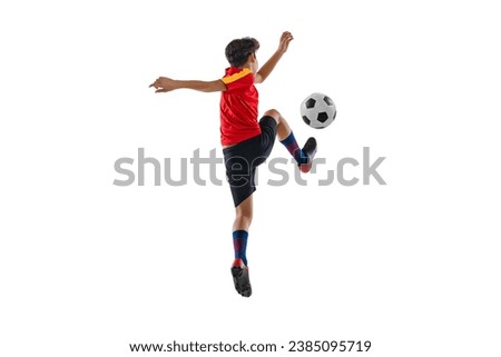 Giving pass. Ball dribbling. Boy, teenager, professional football player in motion, training isolated over white background. Concept of action, team sport game, energy, vitality. Copy space for ad.