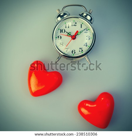 Two hearts and alarm clocks. Valentine's Day. February