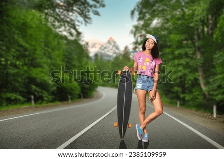 Portrait of carefree young girl riding skateboard
