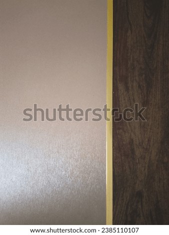 A Wall of Rich Dark Brown and Gold Aesthetic Wood Surface Background Texture Enhanced with Elegant Gold Line - Ideal for Interior Design, Graphics, furniture and Architectural Photography