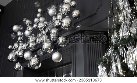 Silver Christmas decorations. Beautiful silver background with shiny silver balls. Festive mood. Christmas or holiday theme