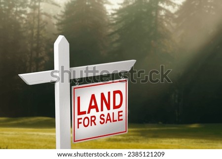 Conceptual sign against beautiful landscape with text - LAND FOR SALE