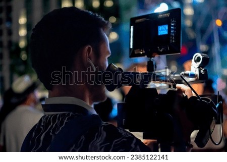 Camera man or Videographer Holding and recording with Professional Video Camera