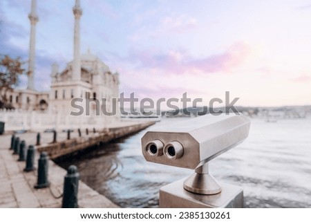 Coin Operated Binocular viewer next to the waterside promenade in Istanbul looking out to the Bay and city. Royalty-Free Stock Photo #2385130261