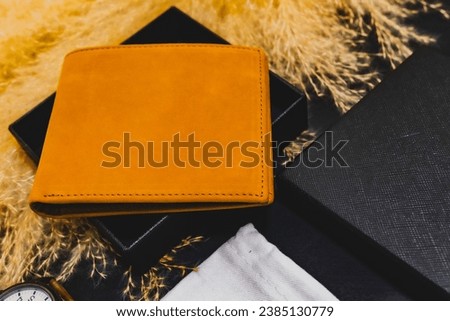Leather bag. Set of photography elements on black background. With hay. Photography set. Promotional item. Studio Shot