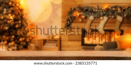 Empty wooden table in room decorated for Christmas. Banner with space for design