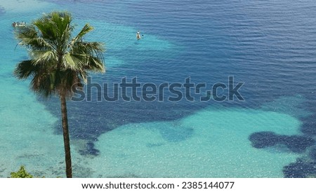 The beautiful Plage des Marinieres in Villefranche-sur-Mer in the departement Alpes-Maritimes in the region Provence-Alpes-Côte d’Azur in France, in the month of June Royalty-Free Stock Photo #2385144077