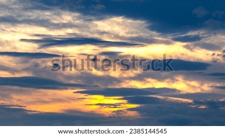 brightly colorful clouds in the evening sky. Lush colored clouds in the sky before sunset