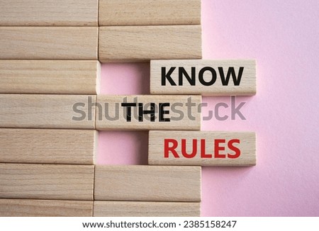 Know the rules symbol. Wooden blocks with words Know the rules. Beautiful pink background. Business and Know the rules concept. Copy space.