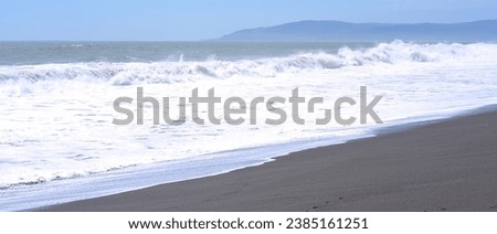 Costa Blanca beach, Constitucion, Maule, Chile: waves on black sand beach during windy spring day